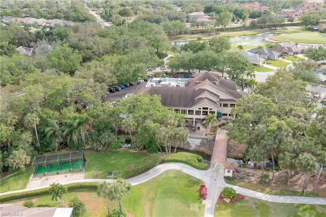 an aerial view of residential house with outdoor space and swimming pool