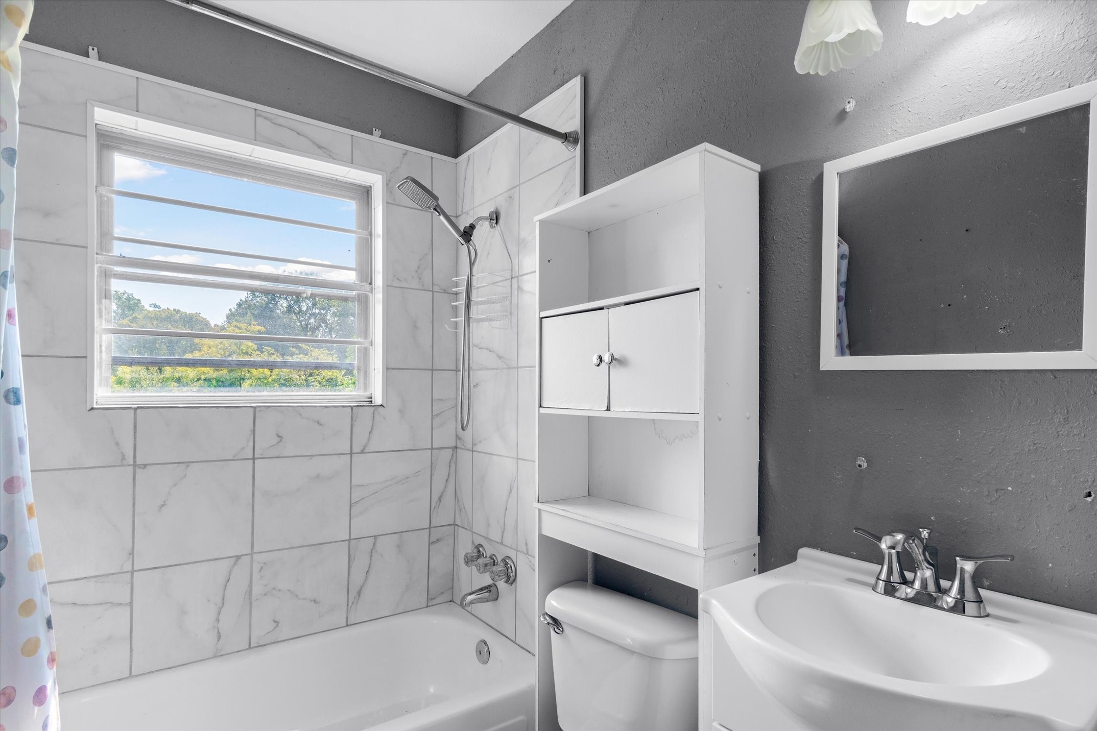 410 Williams Street Athens, TX 75751 - Photo 16 of 30 a bathroom with a sink toilet and shower