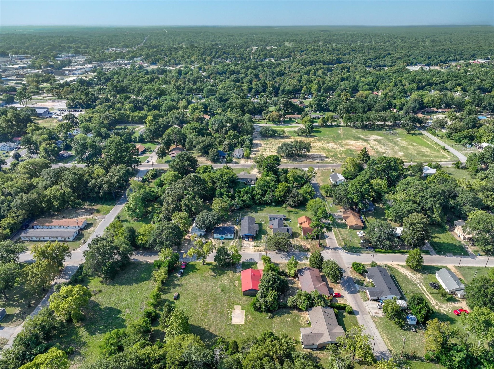 410 Williams Street Athens, TX 75751 - Photo 26 of 30 an aerial view of residential houses with outdoor space and trees