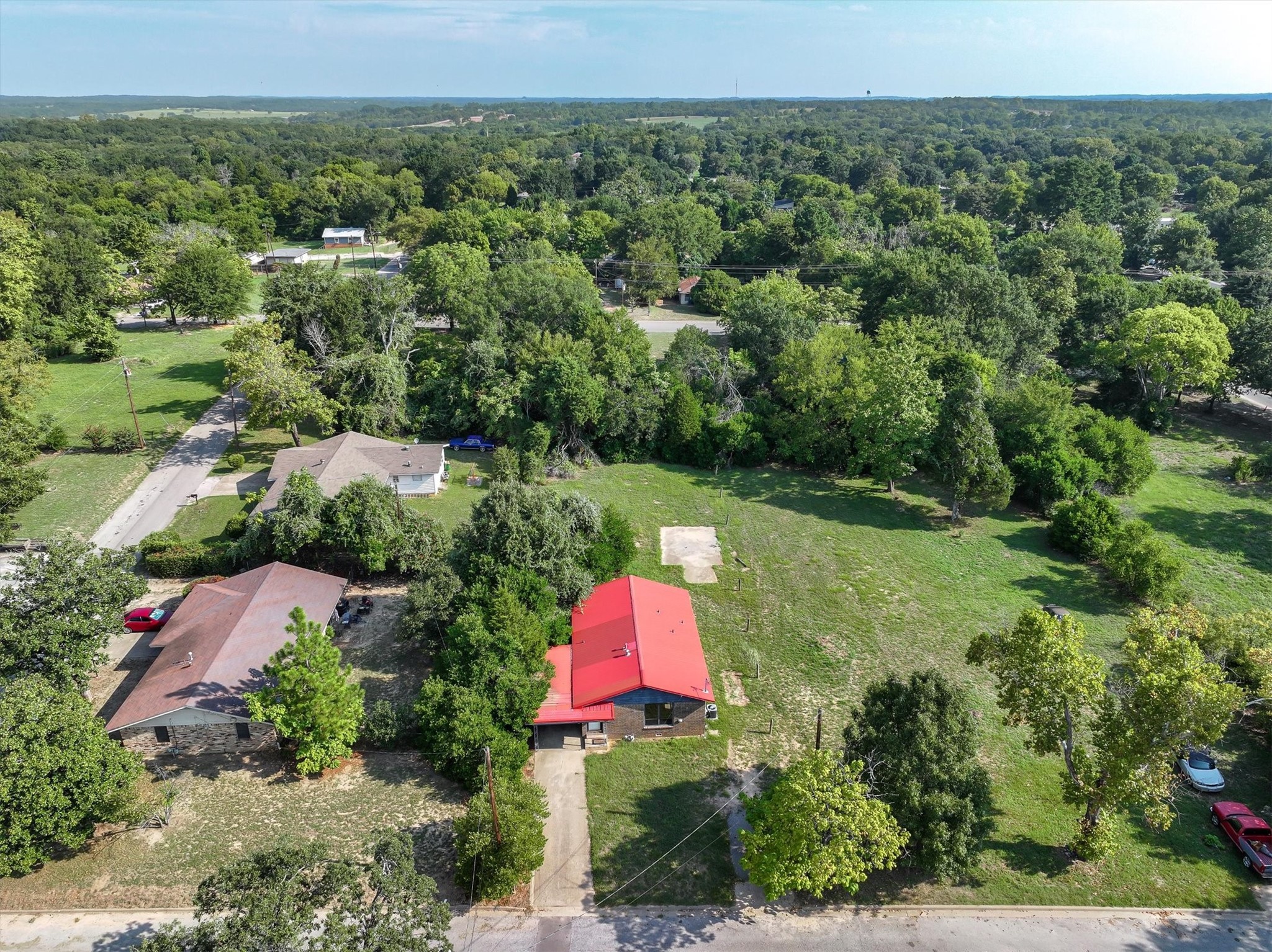 410 Williams Street Athens, TX 75751 - Photo 30 of 30 an aerial view of residential house with outdoor space and trees all around