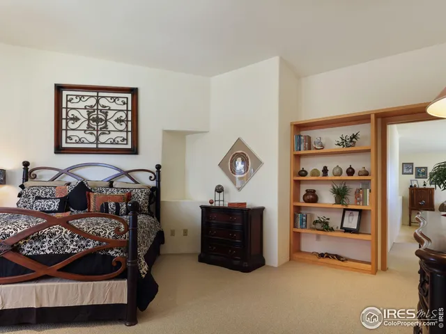 a bedroom with bed and a window