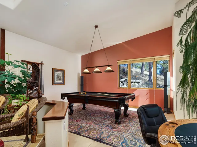 a room with a sink cabinets and appliances