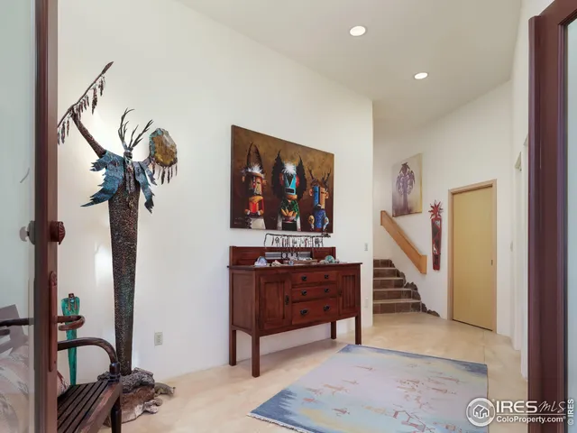 a view of a hallway with couch and dresser