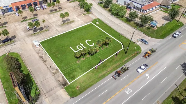 a view of a backyard with potted plants
