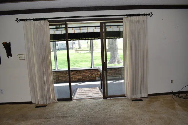 a view of a room with a large window