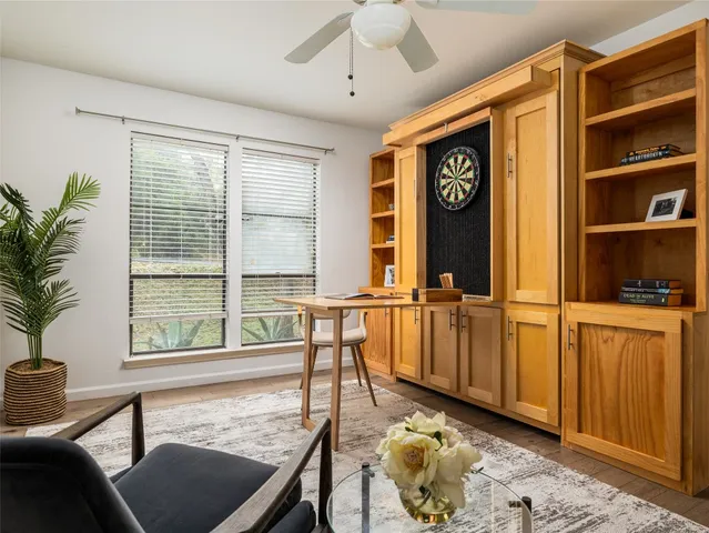 a view of a livingroom with furniture and windows