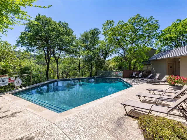 a view of a swimming pool with lounge chair
