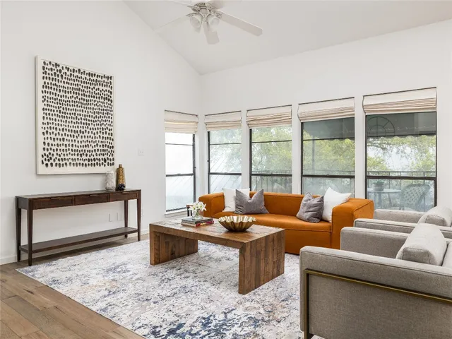 a living room with furniture and a potted plant