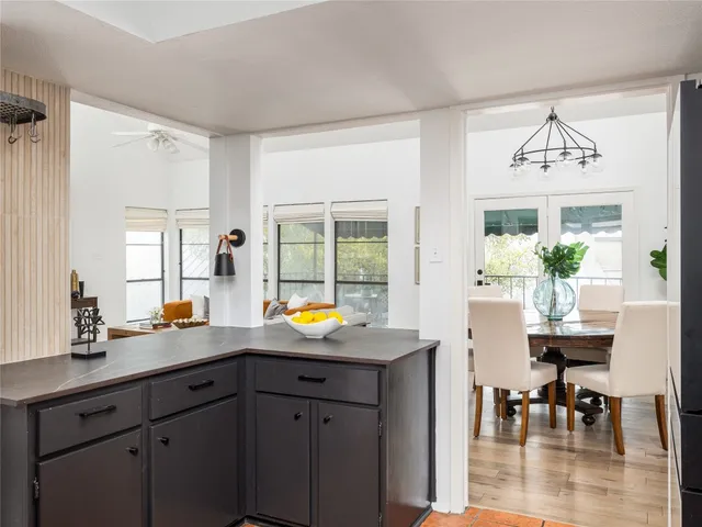 a view of kitchen island dining table and wooden floor