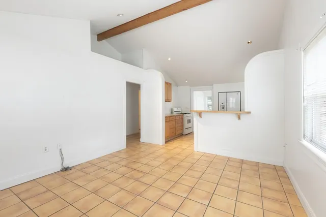 a view of a kitchen with wooden floor