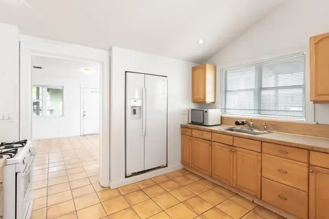 a bathroom with a sink a mirror and a shower