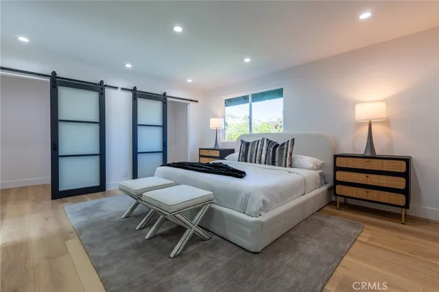 a bedroom with a bed and a table