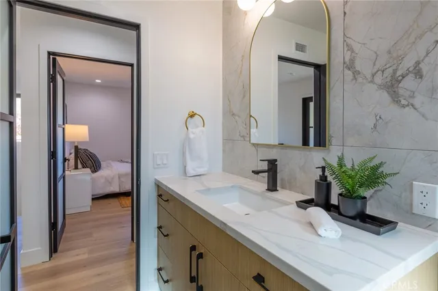 a bathroom with a sink and a mirror