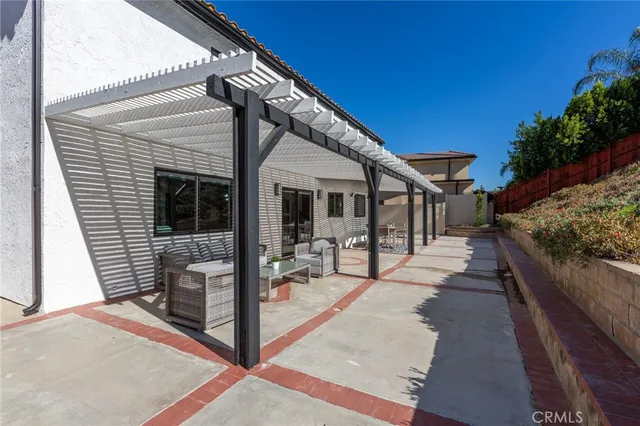 a view of a house with backyard and porch