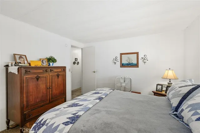 a bathroom with a sink a toilet a mirror and bathtub