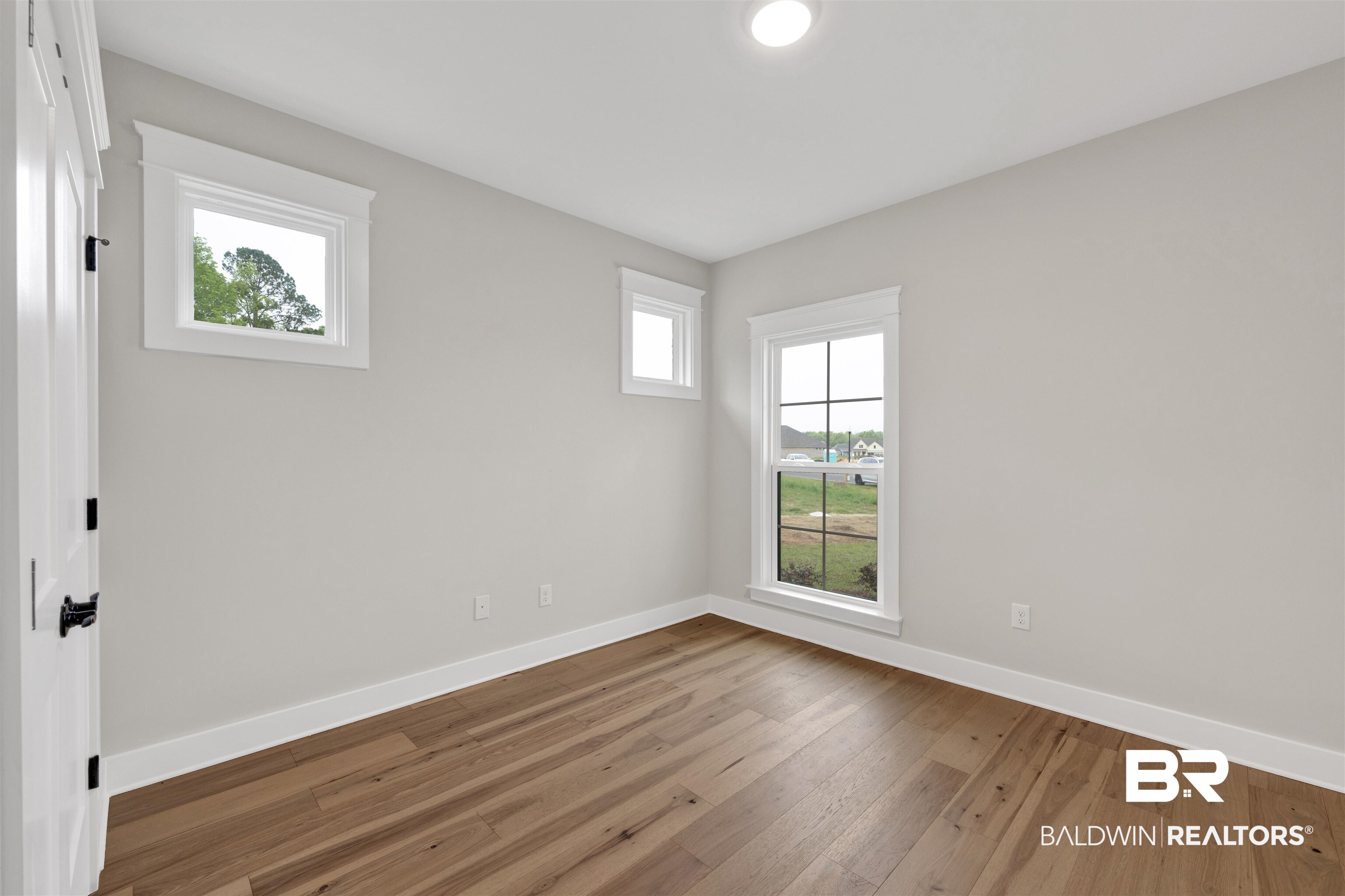 27382 Patch Pl Loop Daphne, AL 36526 - Photo 26 of 31 Unfurnished room featuring light wood finished floors and plenty of natural light