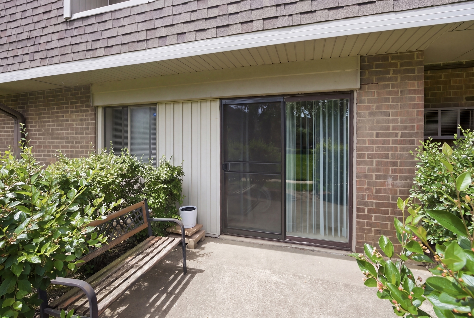 154 East Bailey Road, Unit D Naperville, IL 60565 - Photo 16 of 20 a couple of potted plants in front of door