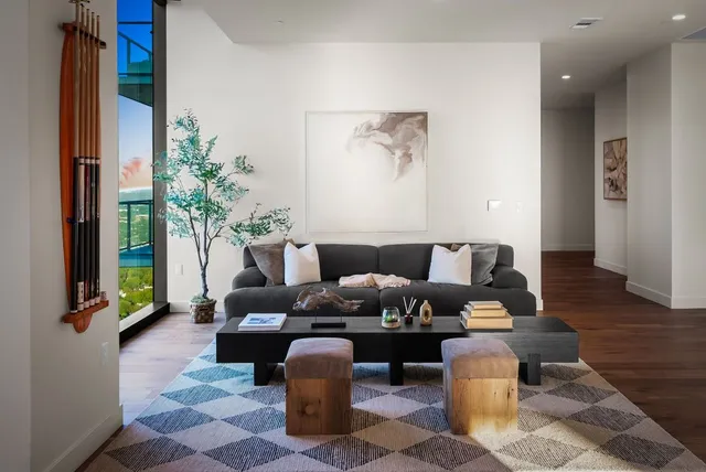 a living room with furniture and a large window