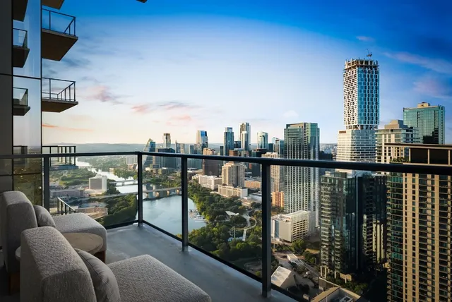 a living room with hard wood floor and furniture