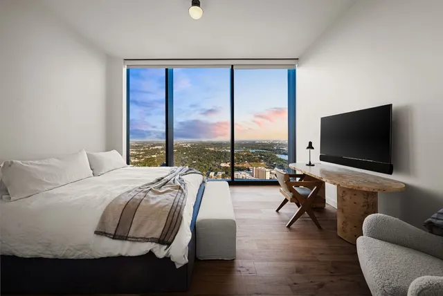 a bathroom with a toilet sink and shower