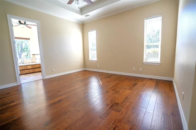 a view of a bath tub sitting in a bathroom next to a window