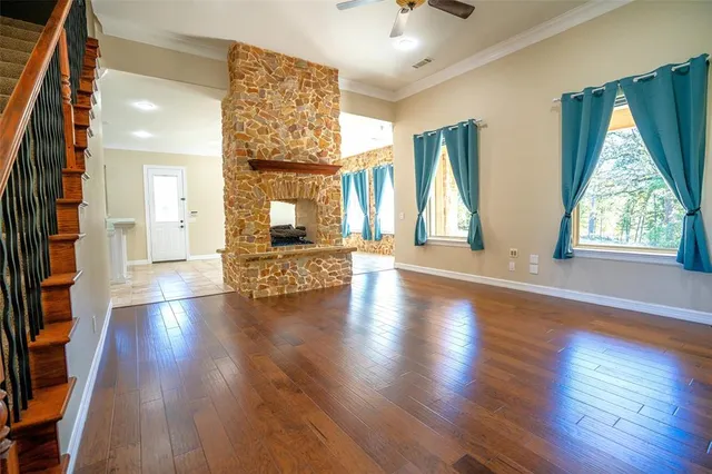 a view of an entryway with wooden floor and door
