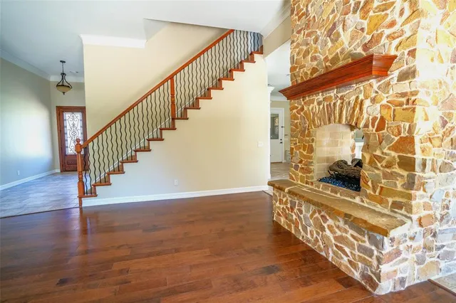 a view of an entryway with wooden floor