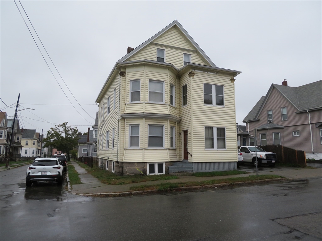 685 Cottage, Unit 1 New Bedford, MA 02745 - Photo 1 of 13 a car parked on the side of a road