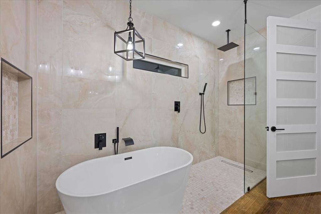 3028 West Frk Way Springtown, TX 76082 - Photo 17 of 31 Your very own spa awaits with tile walls, a free-standing tub, and a marble finish shower