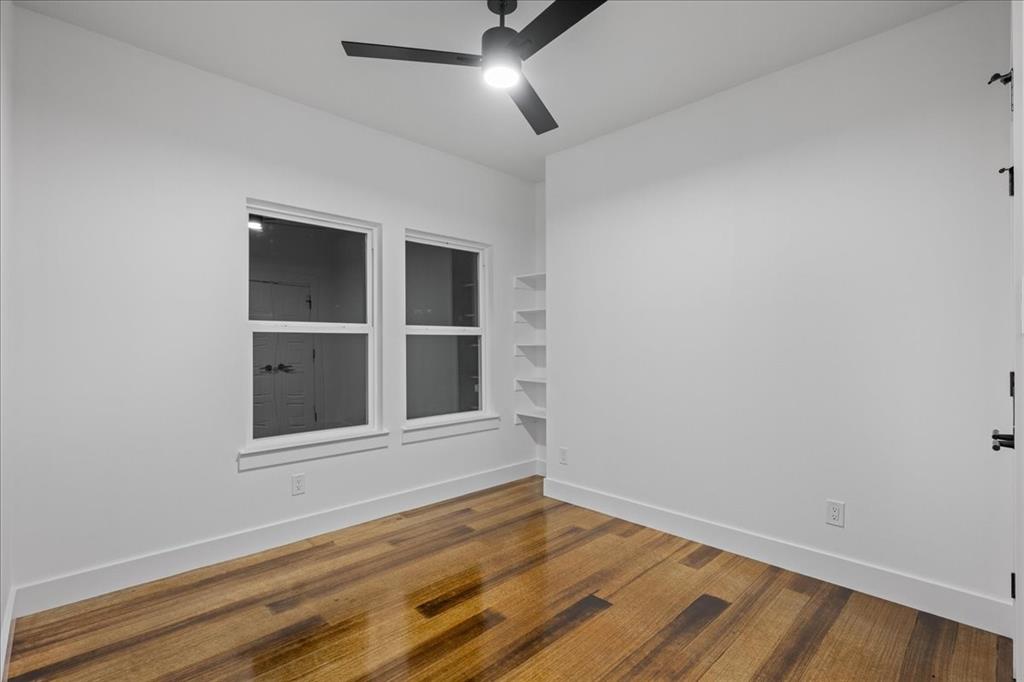 3028 West Frk Way Springtown, TX 76082 - Photo 6 of 31 Bedroom 1 offers versatility. Anything from a guest bedroom to a home office works in this flex space!