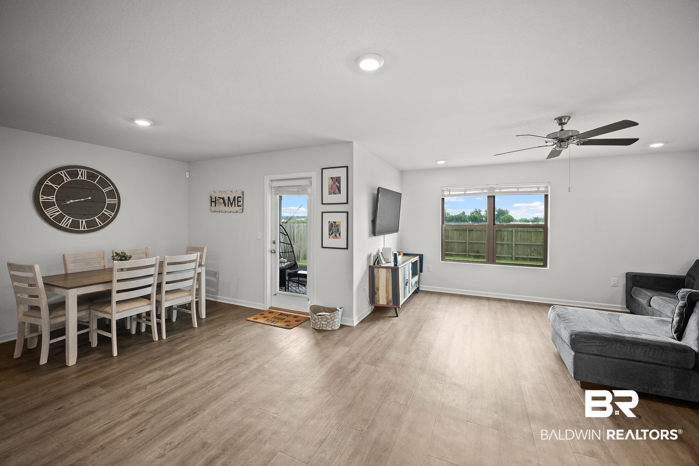 32030 Terranova Loop Lillian, AL 36549 - Photo 9 of 30 Open-concept living area with wood-finish flooring, recessed lighting, and a ceiling fan