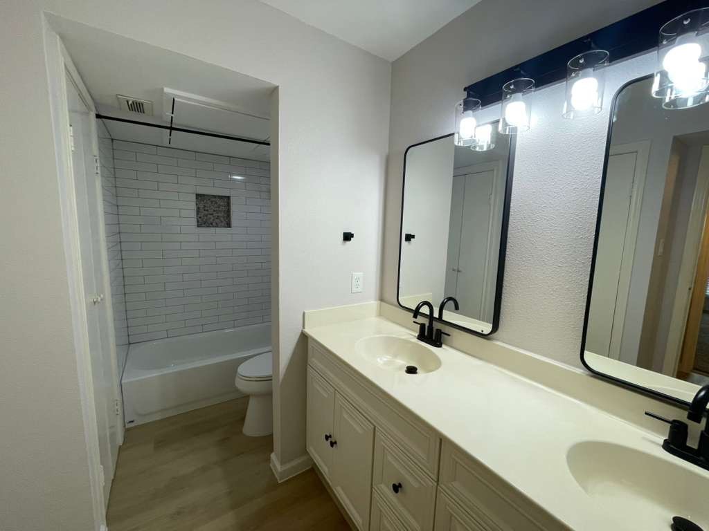 7950 North Stadium Drive, Unit 172 Houston, TX 77030 - Photo 12 of 13 a bathroom with a sink and mirror with toilet