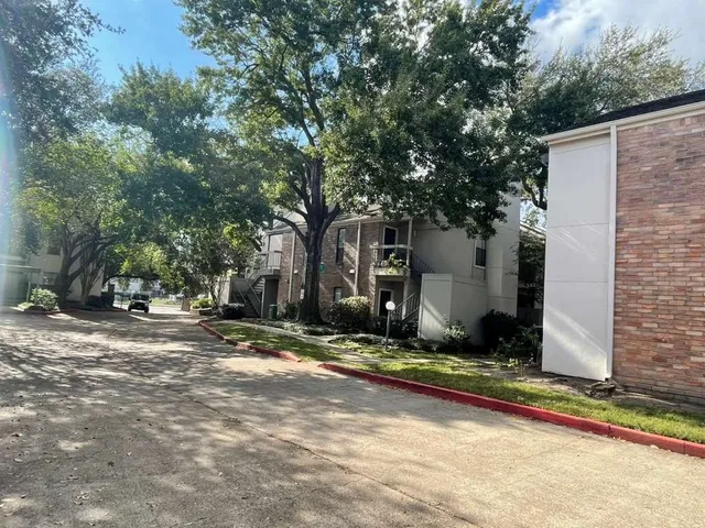 a view of a backyard of the house