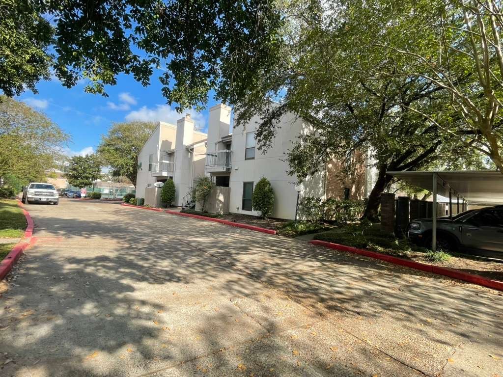 7950 North Stadium Drive, Unit 172 Houston, TX 77030 - Photo 2 of 13 a view of road with large trees