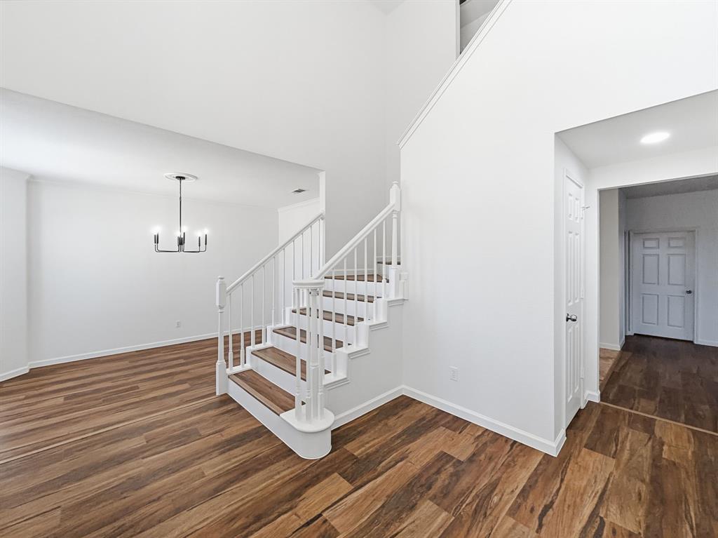 730 Fairlawn Street Allen, TX 75002 - Photo 3 of 40 a view of an entryway with wooden floor