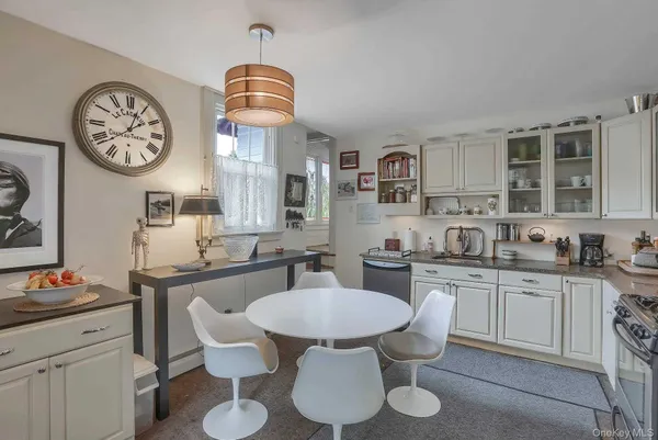 a kitchen with a dining table and chairs