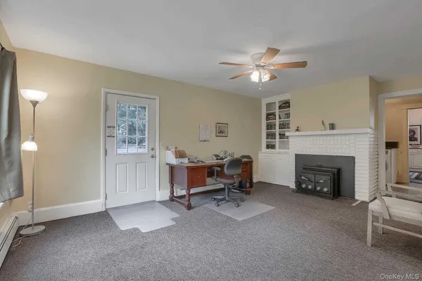 a view of a livingroom with furniture and a fireplace