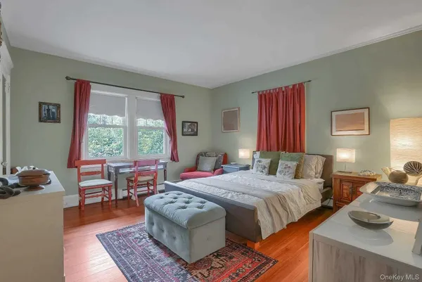 a bedroom with two beds and a couch