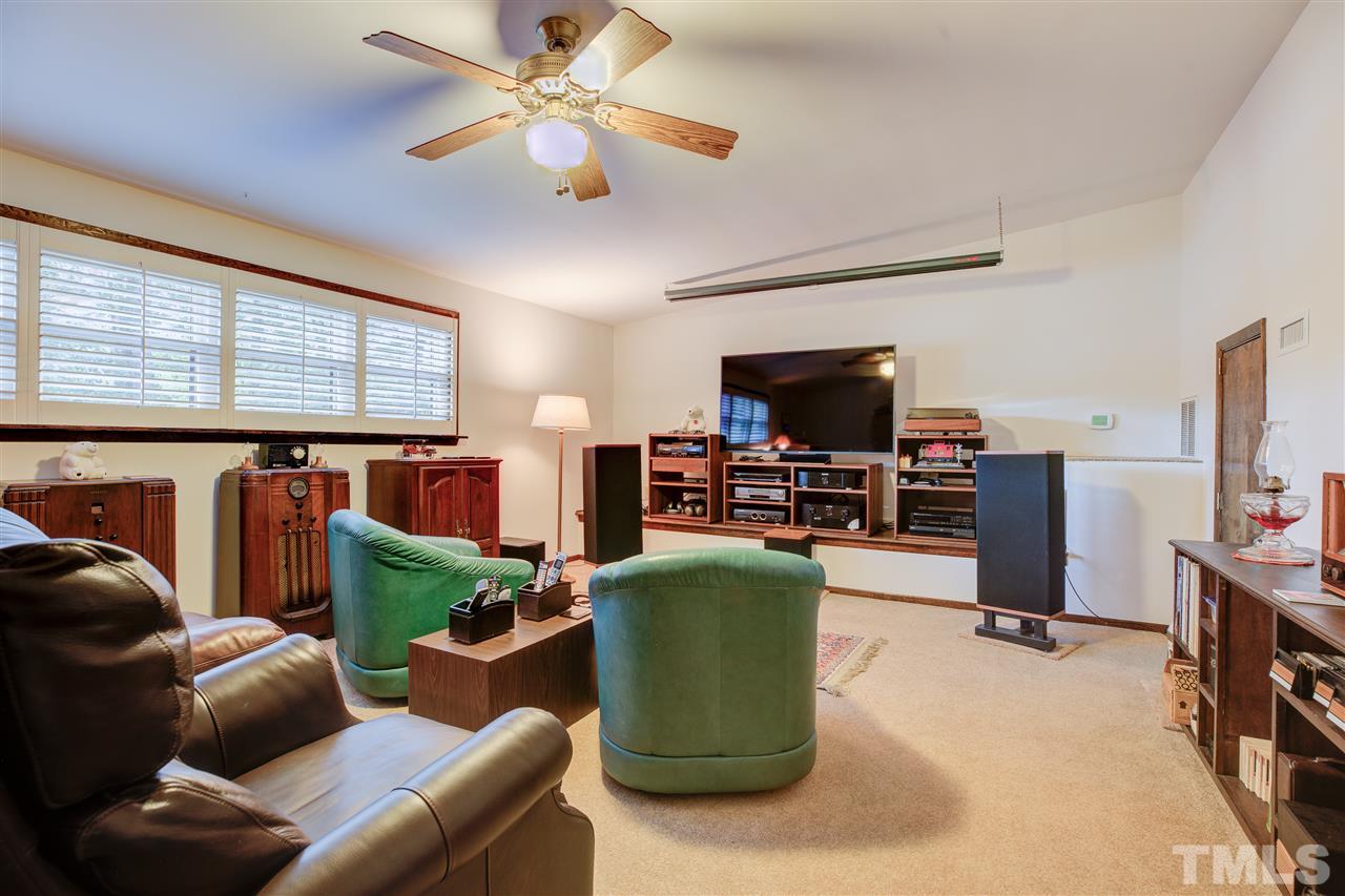 7401 Valley Run Drive Raleigh, NC 27615 - Photo 14 of 22 a living room with furniture and a flat screen tv