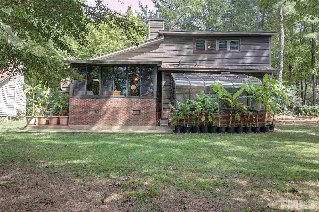 7401 Valley Run Drive Raleigh, NC 27615 - Photo 22 of 22 a front view of a house with garden