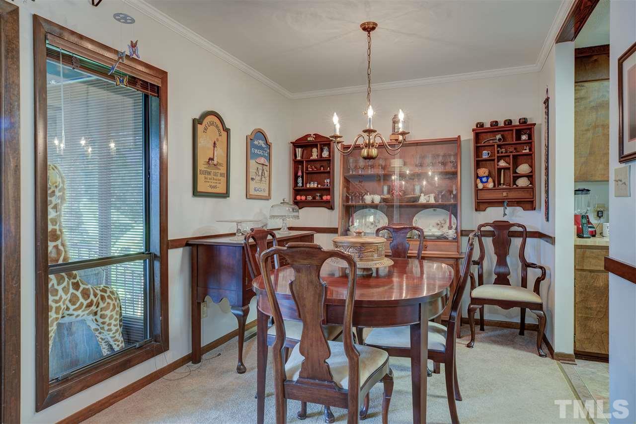 7401 Valley Run Drive Raleigh, NC 27615 - Photo 5 of 22 a view of a dining room with furniture and chandelier