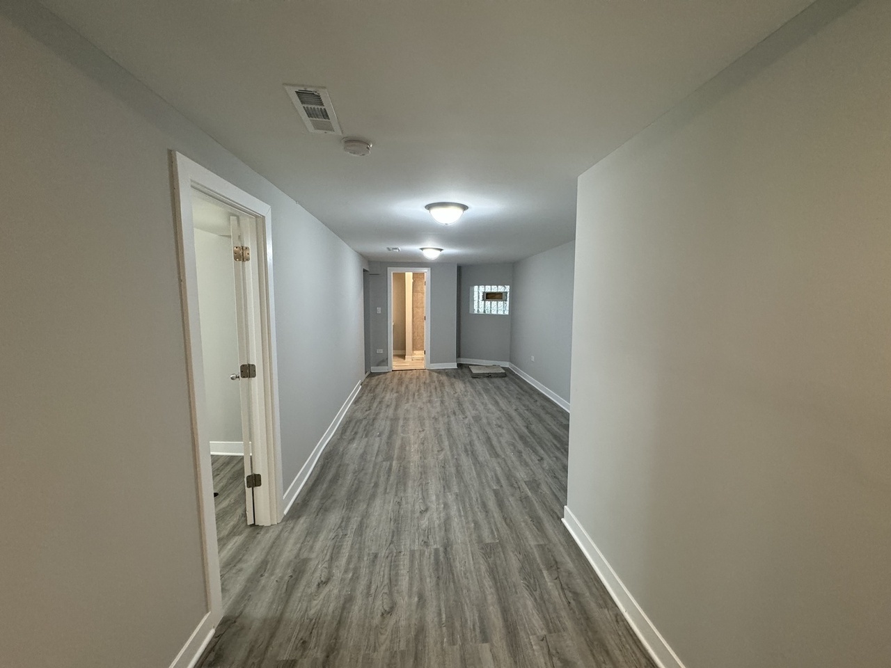 6830 South Michigan Avenue Chicago, IL 60637 - Photo 6 of 10 a view of a hallway with wooden floor