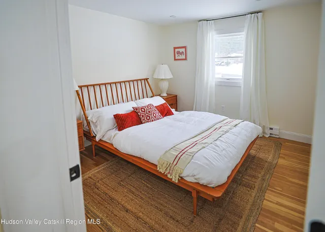 a bedroom with bed and window