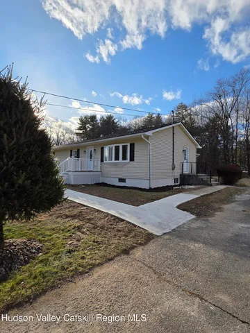 a house view with a backyard space