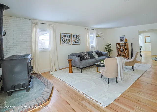 a living room with furniture and a rug