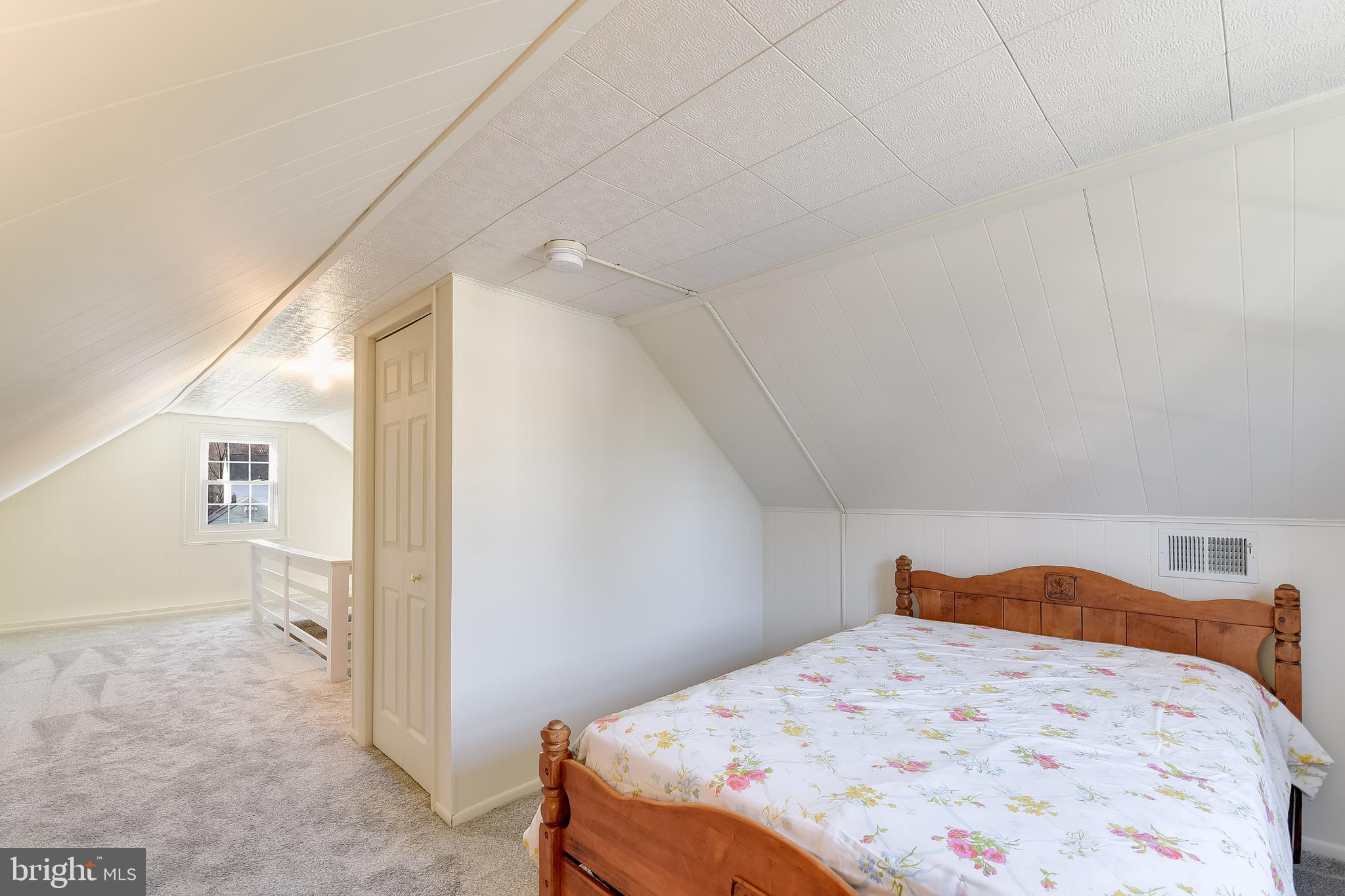 5533 Hutton Avenue Baltimore, MD 21207 - Photo 18 of 39 a bedroom with a bed and a cabinets