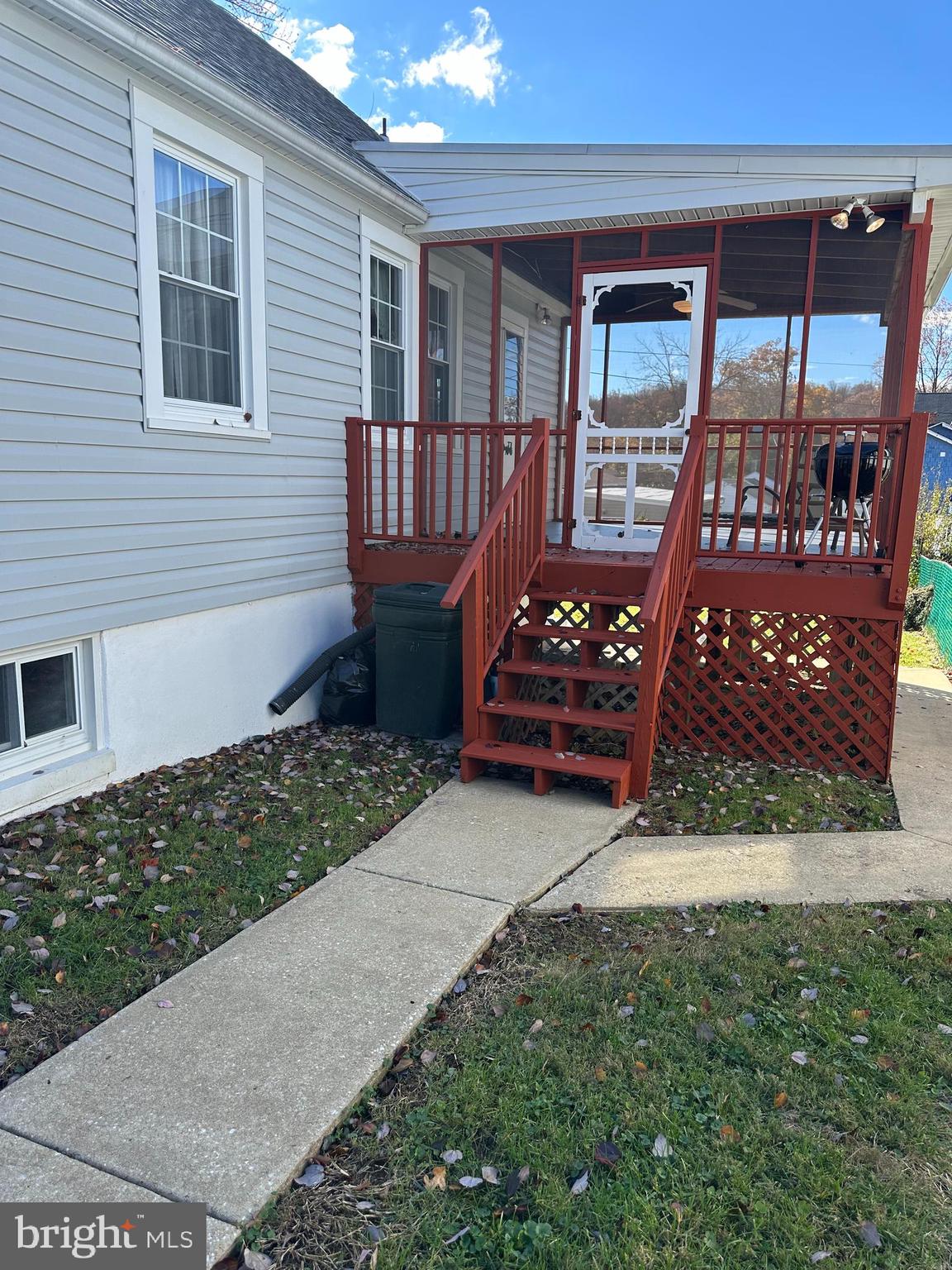 5533 Hutton Avenue Baltimore, MD 21207 - Photo 23 of 39 a view of a wooden bench sitting in front of a house