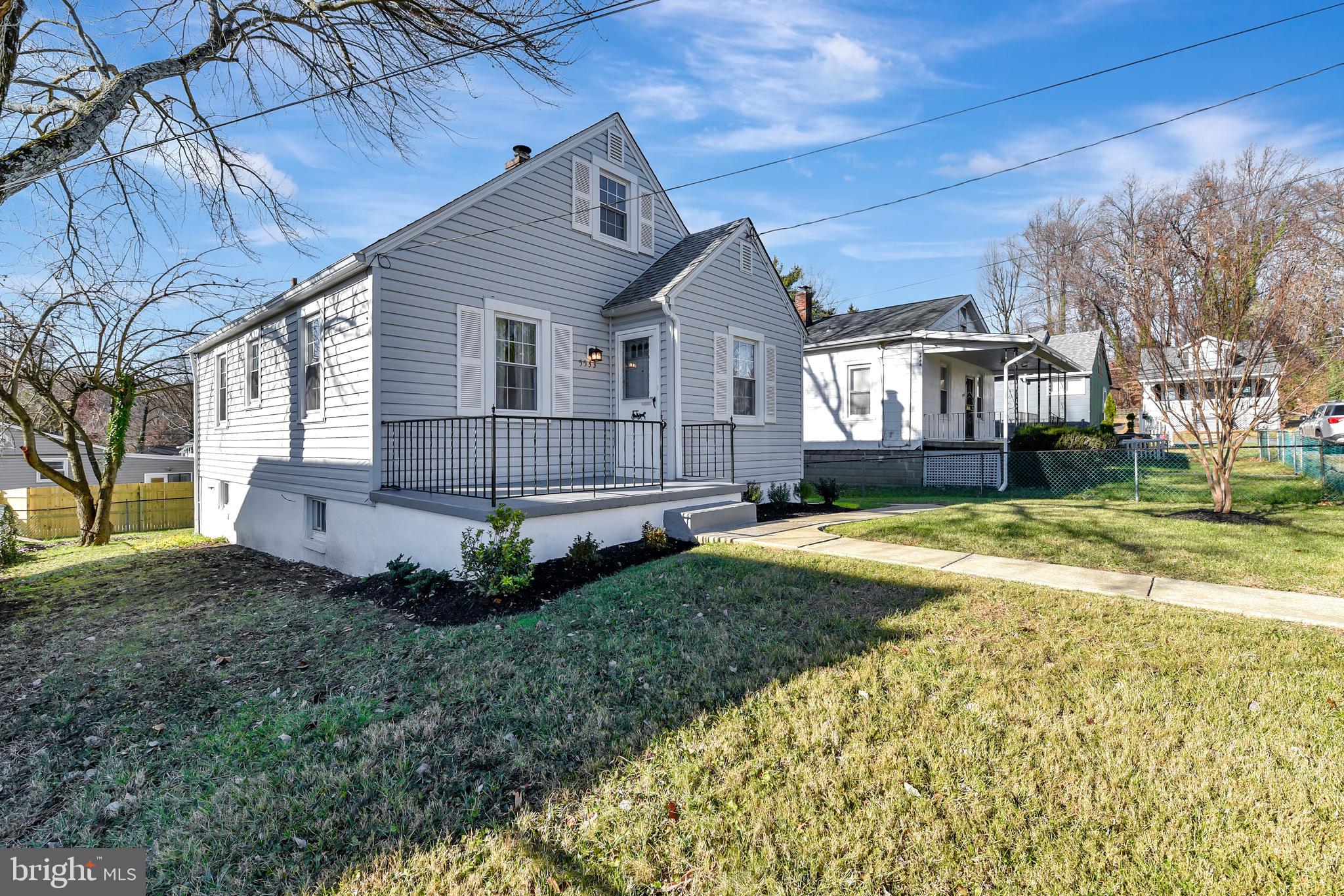 5533 Hutton Avenue Baltimore, MD 21207 - Photo 27 of 39 a front view of a house with a yard