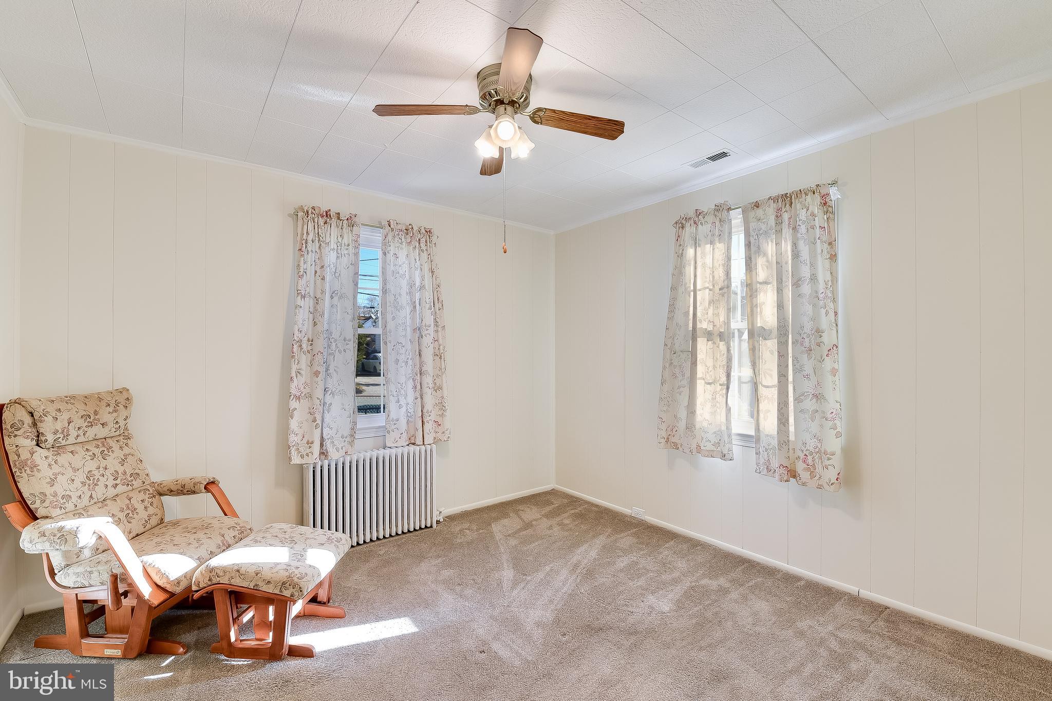 5533 Hutton Avenue Baltimore, MD 21207 - Photo 10 of 39 a living room with furniture and a window