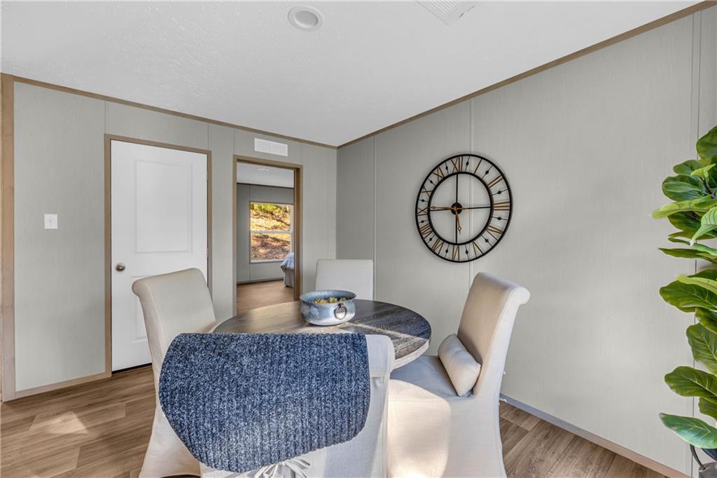 946 Essic Road Ball Ground, GA 30107 - Photo 14 of 45 a living room with furniture a rug and a window